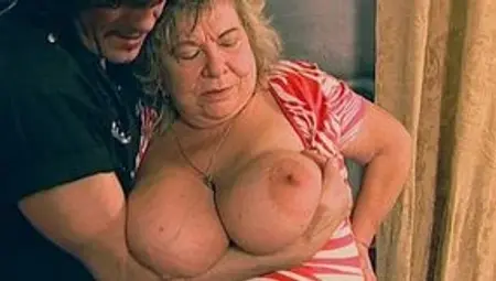 Granny with gigantic tits makes young guys cum too soon!
