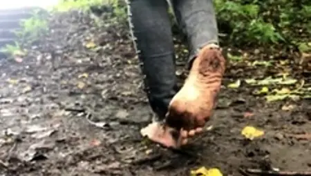 Wild foot fetishist enjoys walking barefoot in the mud
