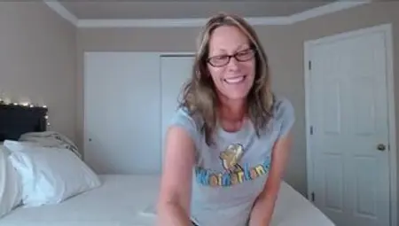 Momma with glasses drills her pussy with rubber dildo