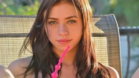 Petite brunette teen Lucie Kline shows her small tits and pleasures herself
