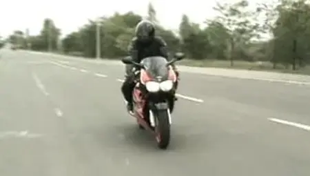 Two bikers caught the young redhead to have a hot 3some