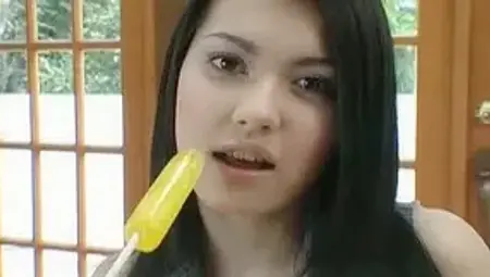 Busty Asian model Maria Ozawa enjoys a lollipop