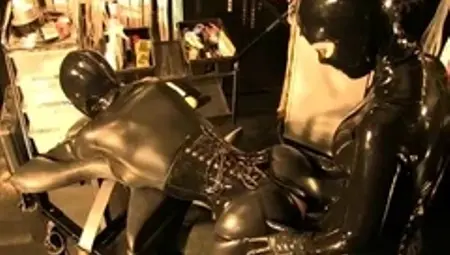 Gloved strapon fetish mistress