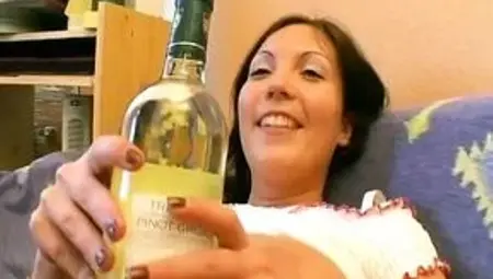 Hot German girl with big tits stuffing a bottle in her shaved pussy