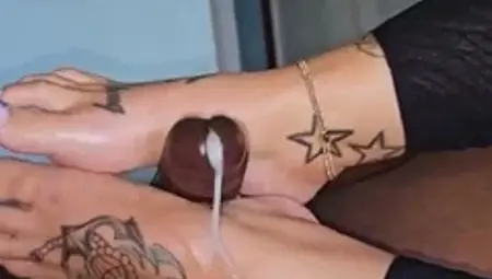 Footjob specialist makes big black cock burst with pleasure
