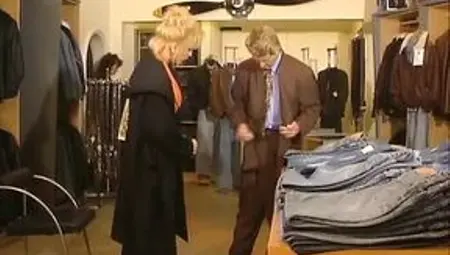 Two beautiful German chicks playing with a long strapon in the bedroom