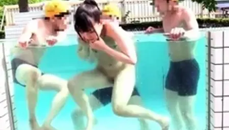 Lovely Asian cutie gets used by three horny guys in the pool