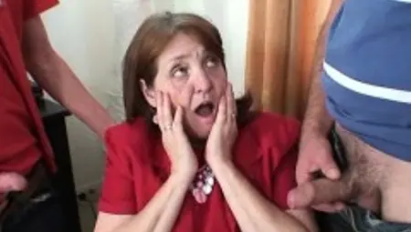 Busty granny in stockings rides and sucks at same time