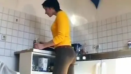 German slut plays with cucumber and sucks dick in the kitchen
