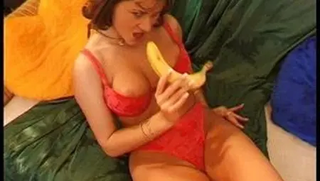 Slut enjoys fucking her pussy with a big banana